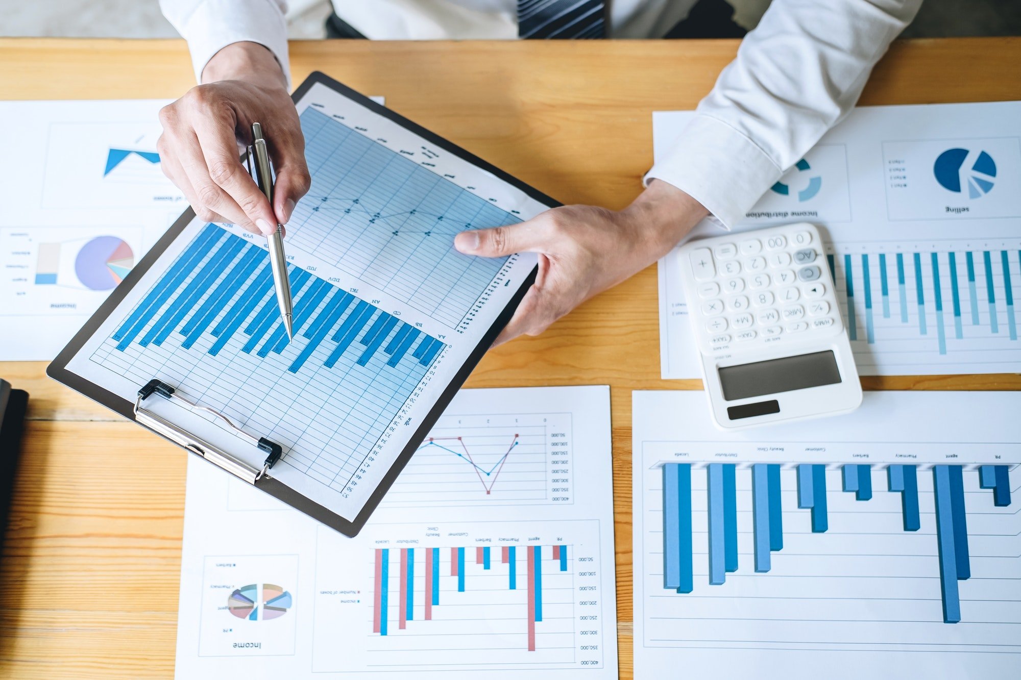 Businessman accountant working analyzing and calculating expense financial annual financial report